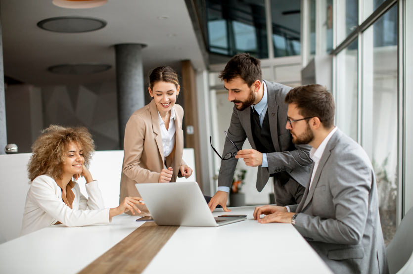 young-business-people-sitting-meeting-table-conference-room-discussing-work-planning-strategy 1