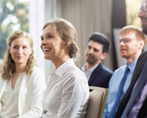 woman-sitting-public-smiling 1